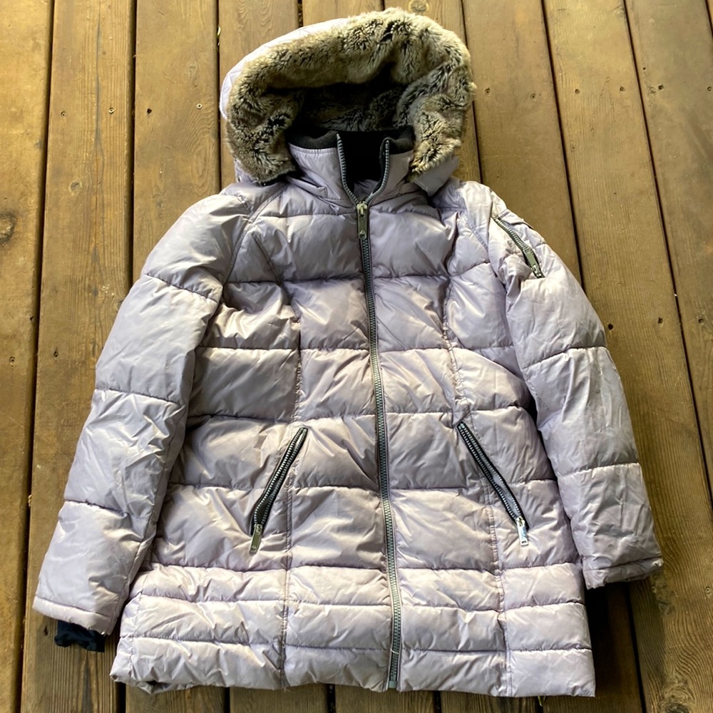 This is a super nice winter jacket. It has a cozy hood and it’s super big.